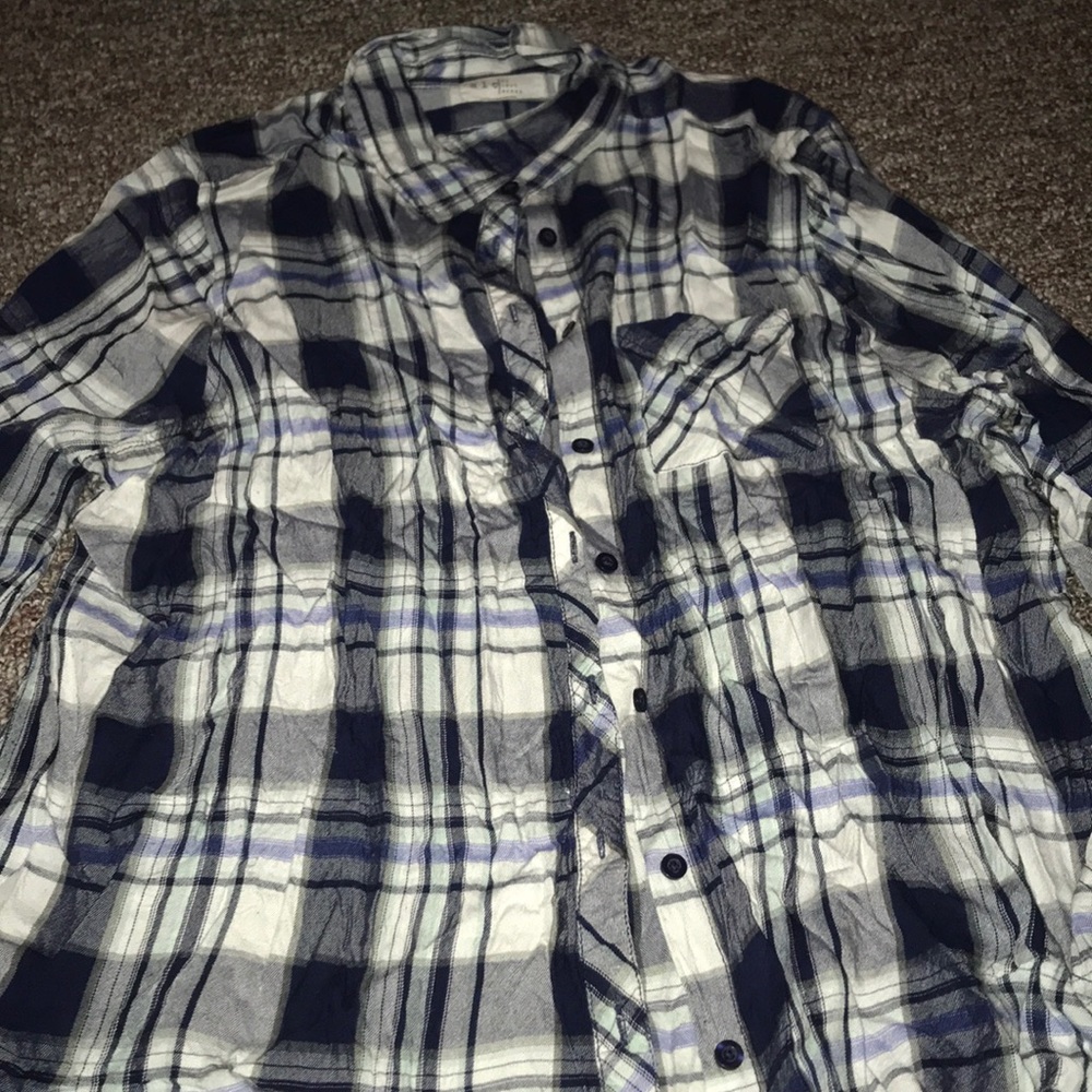 White and blue button up.